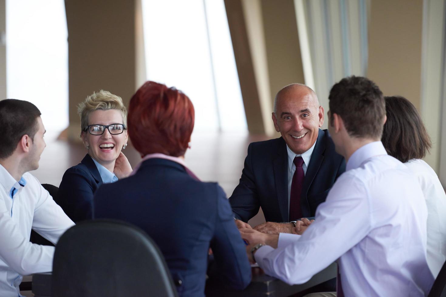 business people group on meeting at modern bright office photo