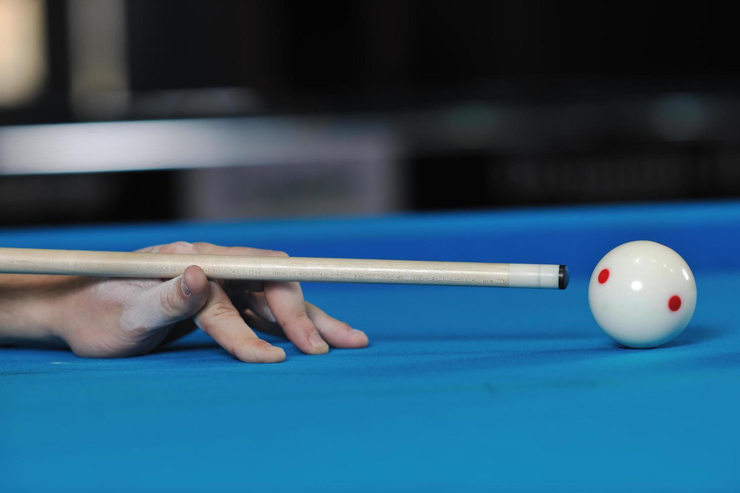 young man play pro billiard game photo