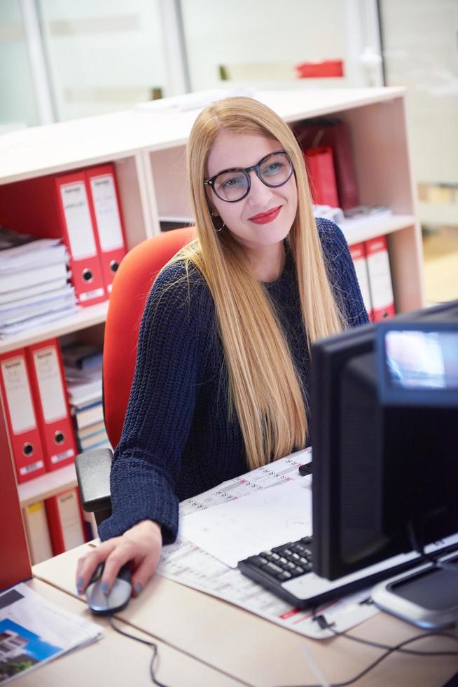 business woman working on computer at office photo