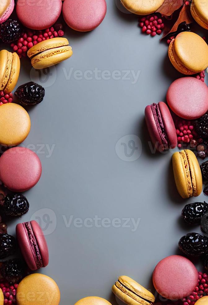 Macaron composition. Frame made of autumn berries and macarons. Autumn, fall concept. Flat lay, top view, copy space photo