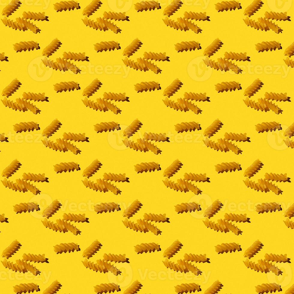 seamless pattern of spiral noodles on a yellow background photo
