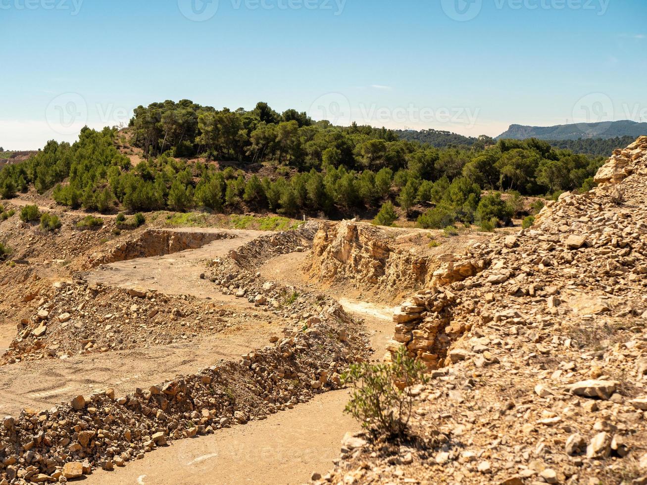 Landscape of an old quarry with mountains on a background photo