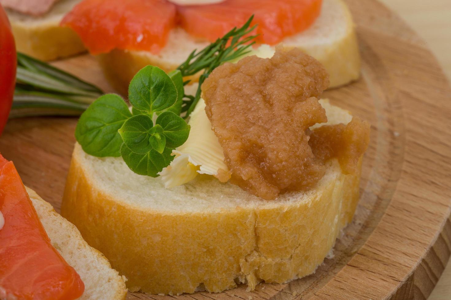 Assorted tapas on wooden board photo