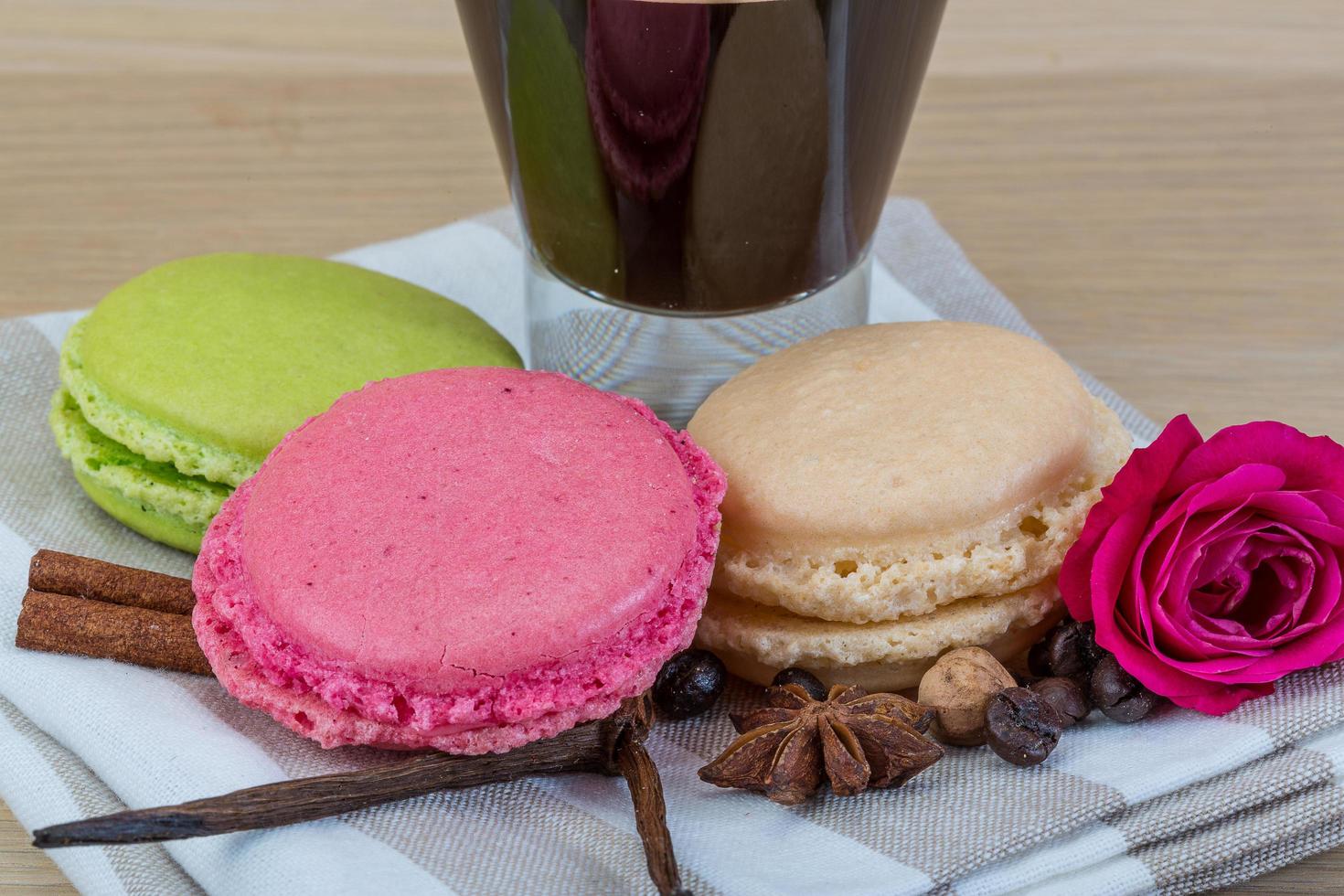 Macaroons delicious on wooden background photo