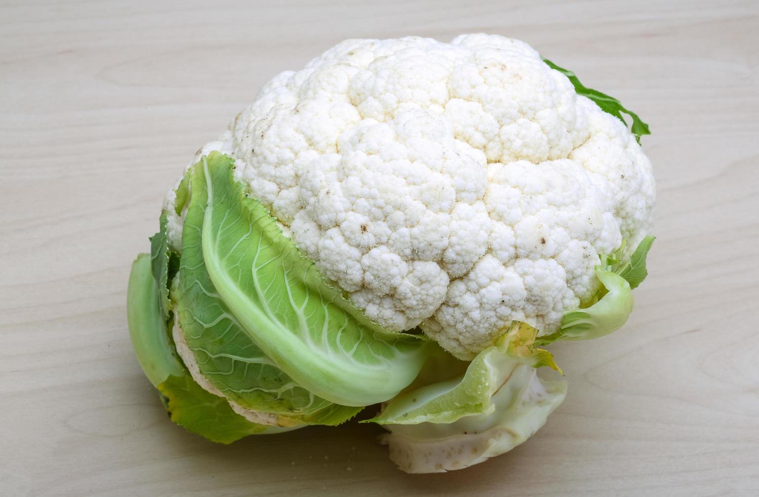 Cauliflower on wooden background photo