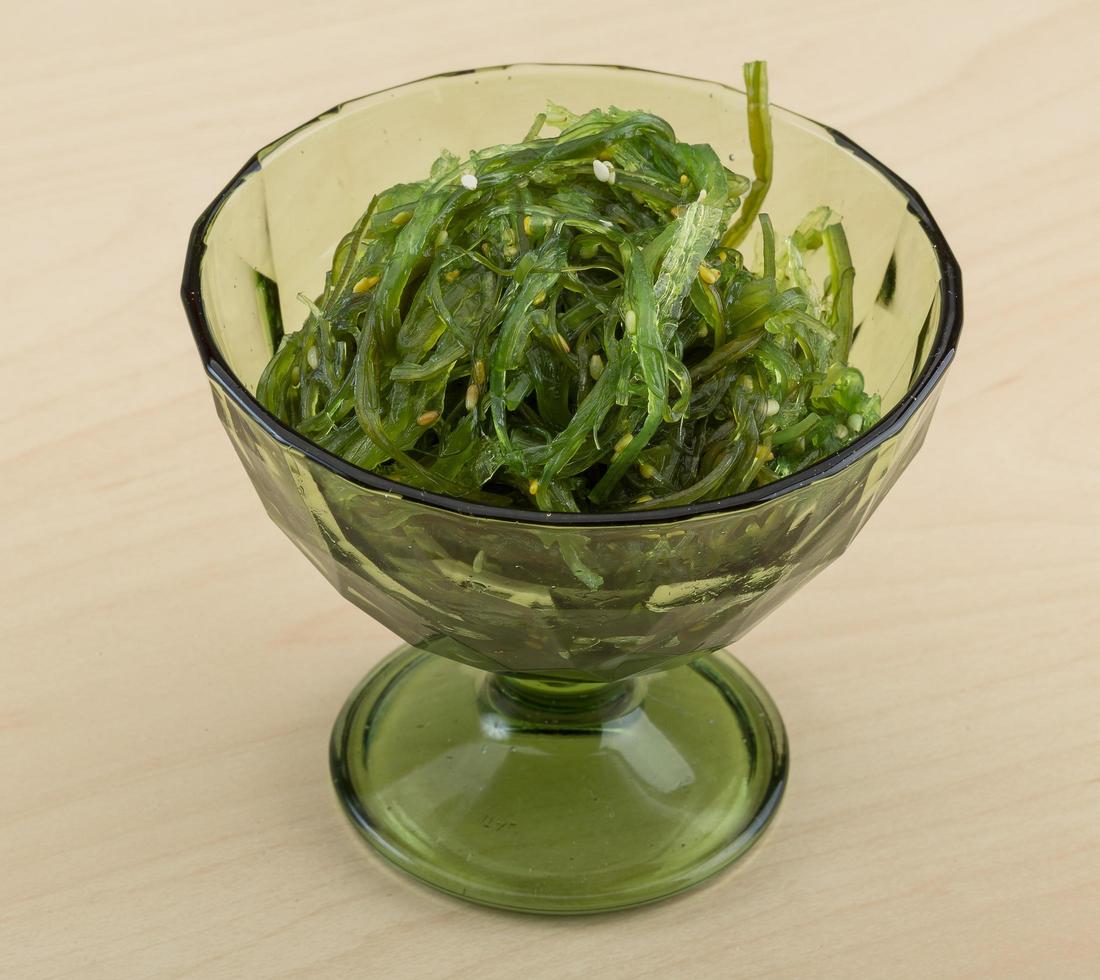 Chuka salad in a bowl on wooden background photo