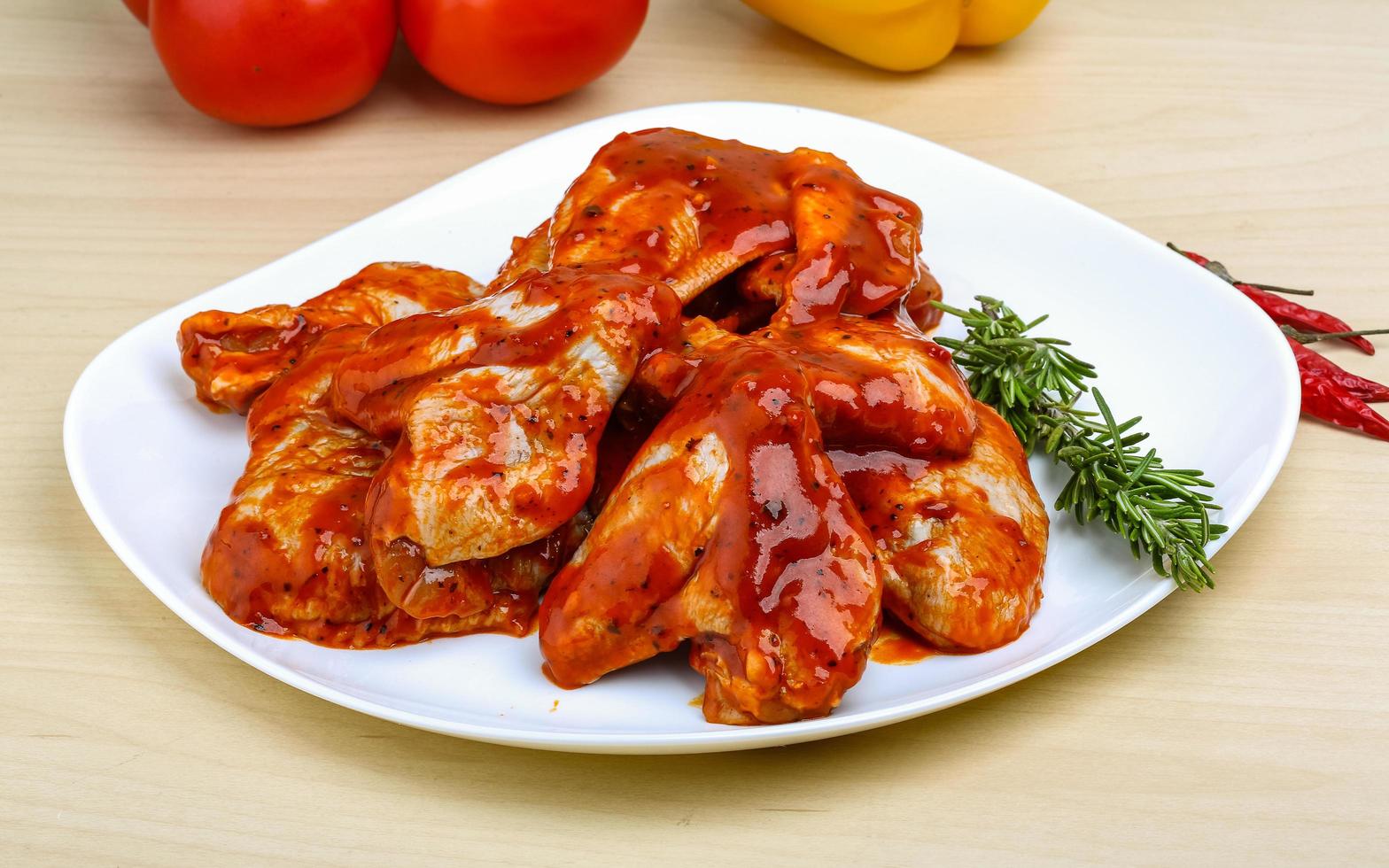 Chicken wings on the plate and wooden background 12511394 Stock Photo