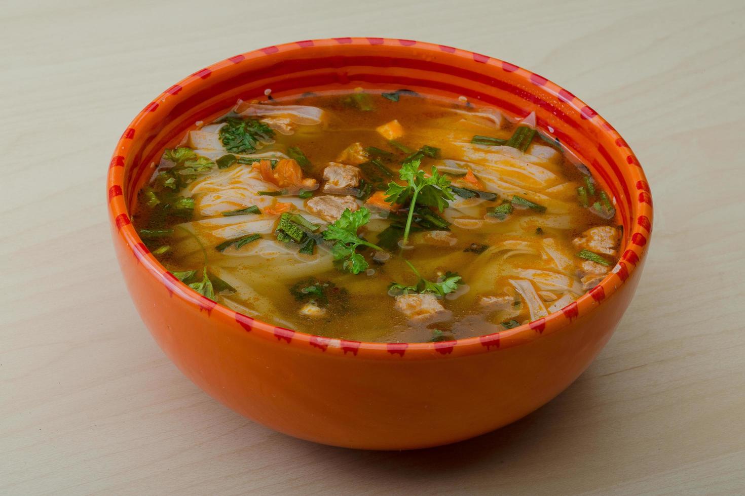 Soup Pho in a bowl on wooden background photo