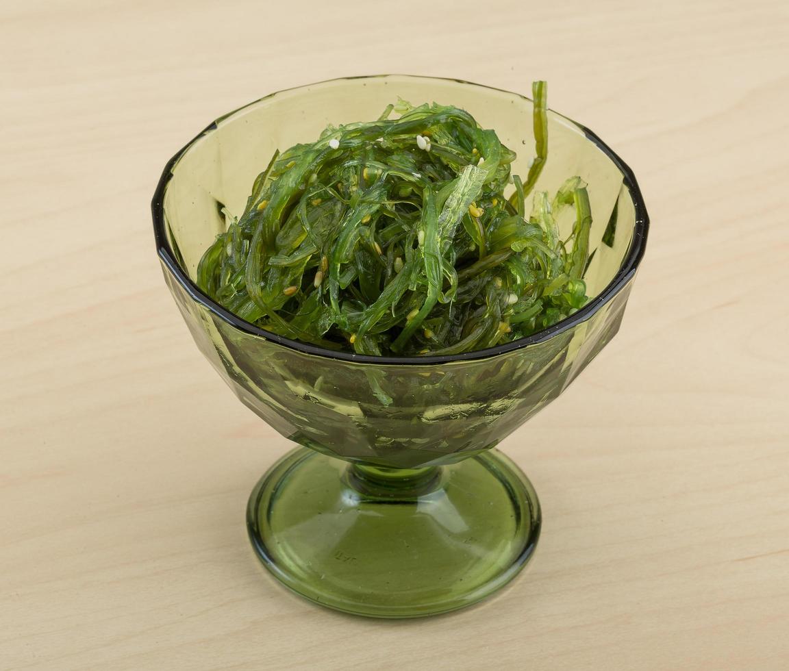 Chuka salad in a bowl on wooden background photo
