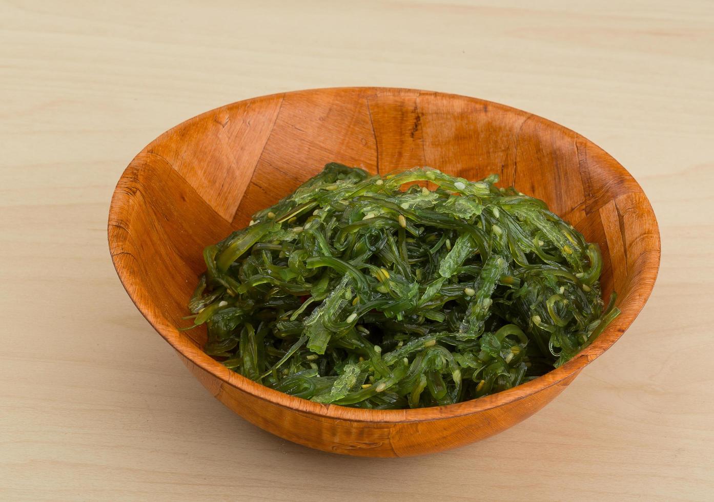 Chuka salad in a bowl on wooden background photo