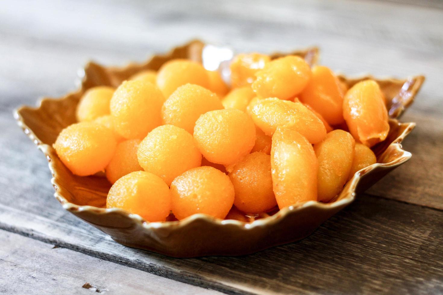 Thai Desserts   Drops of gold and Jackfruit seed on leaf-shaped plates. photo