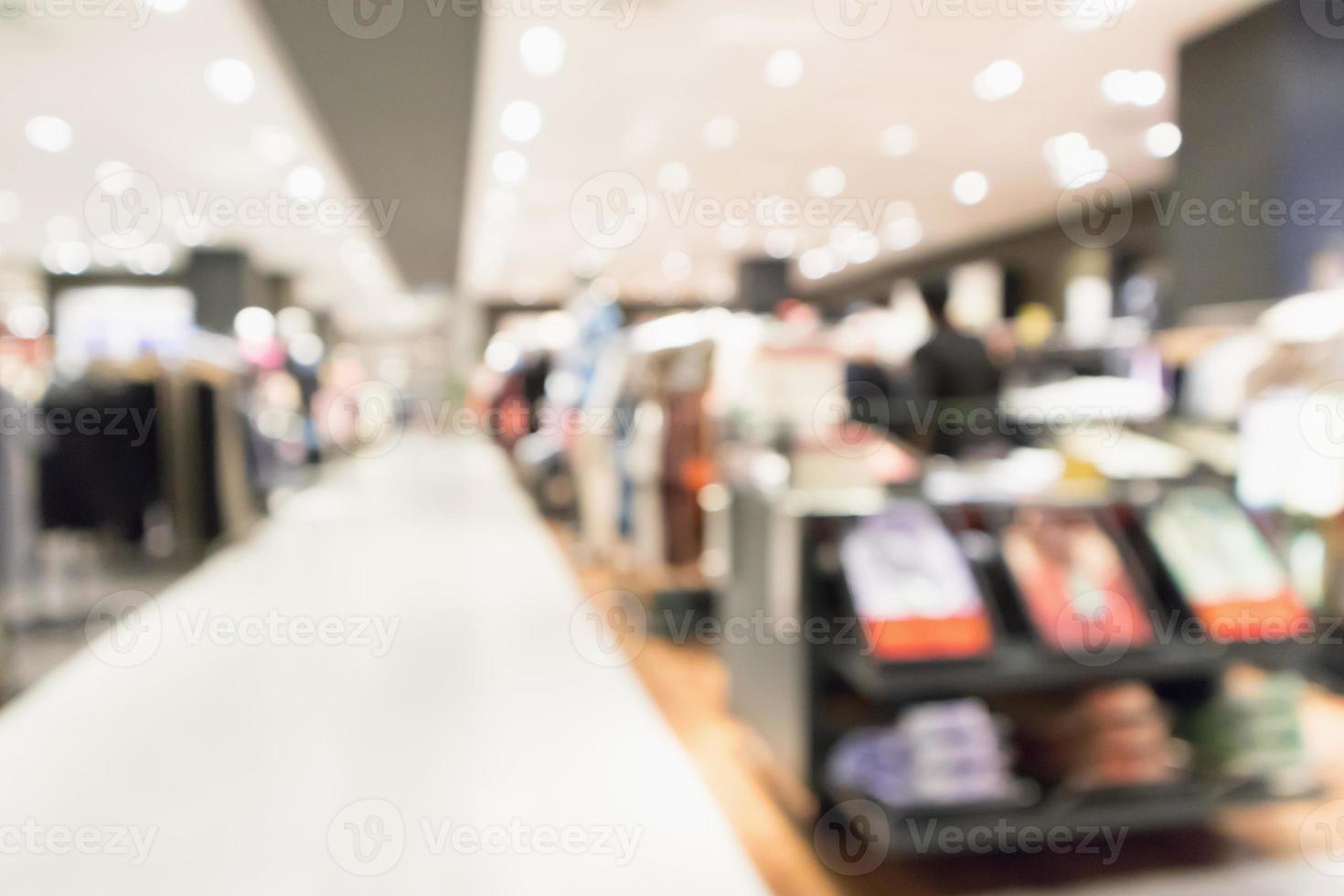 Abstract blur clothing boutique display interior of shopping mall background photo