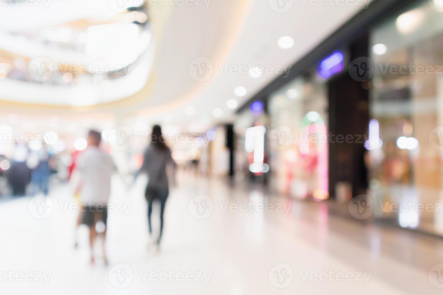 Abstract blur people in modern shopping mall interior defocused background photo