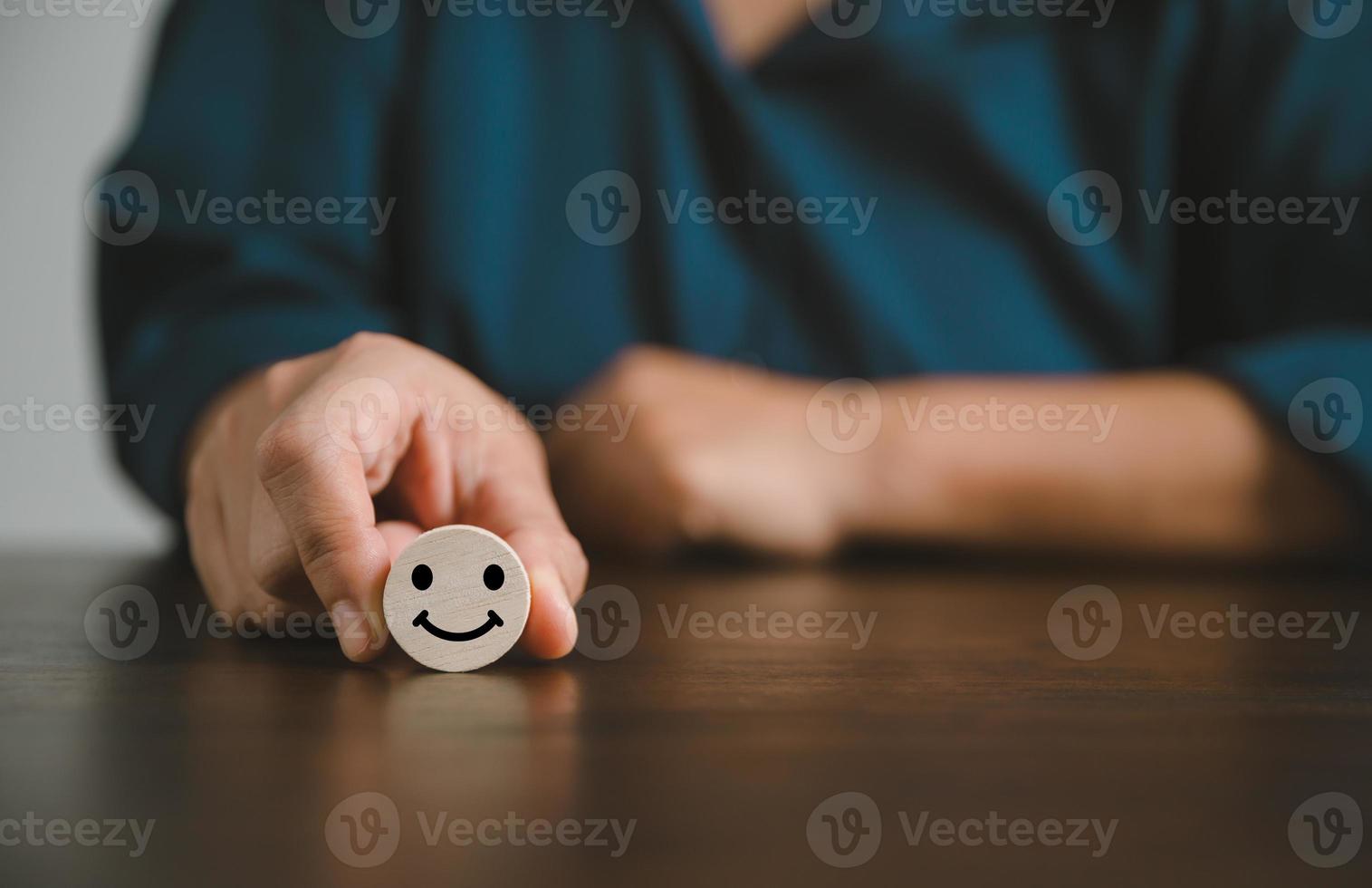 Satisfaction survey concept. Customer services best excellent business rating experience. Hand of business chooses a smile face on wood block circle. 5 Star Satisfaction. People feel great product. photo