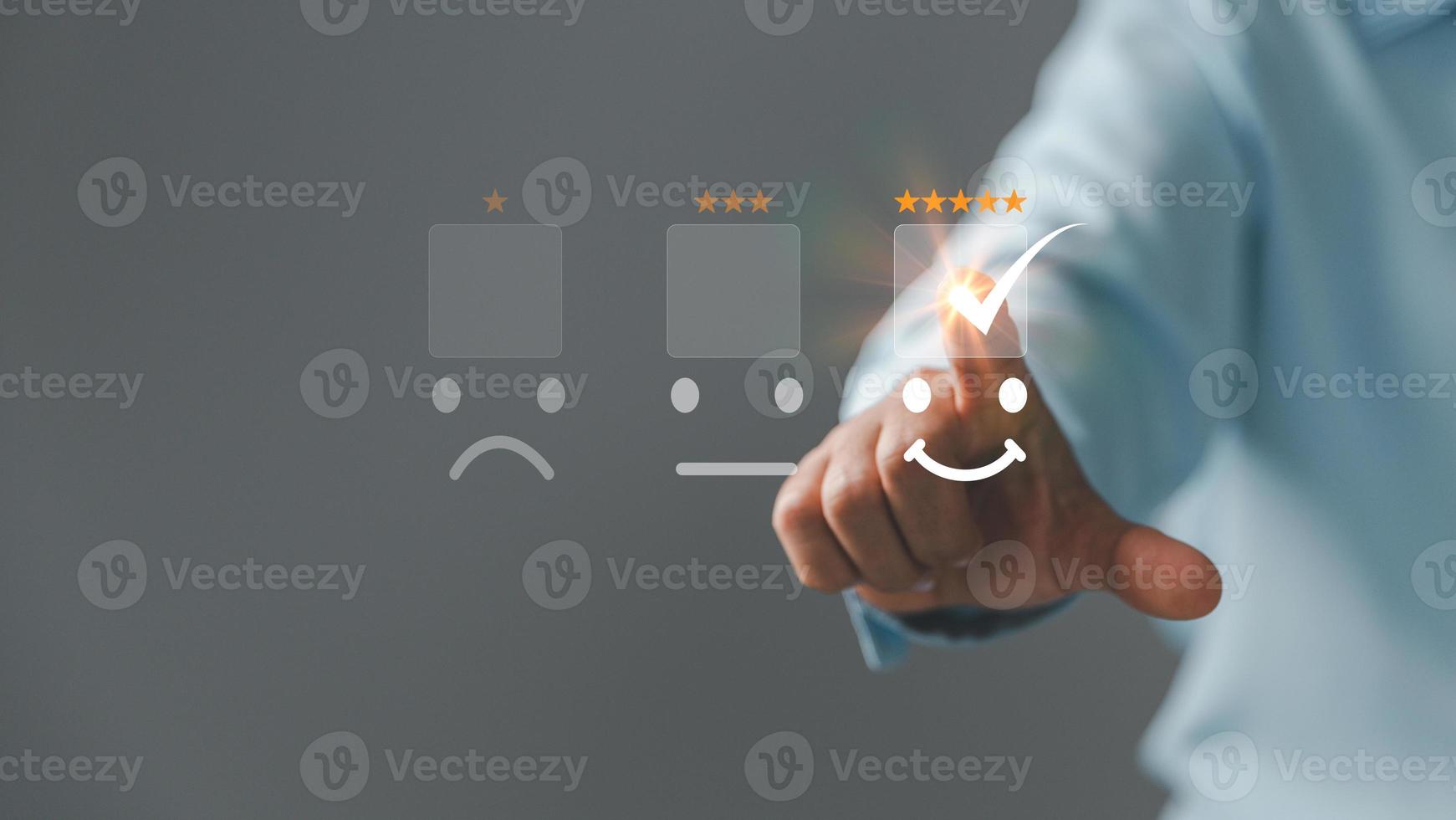 Customer service and Satisfaction concept, Five star consumer feedback. Business people are touching virtual screen on happy Smiley face icon to give satisfaction in service. rating very impressed. photo