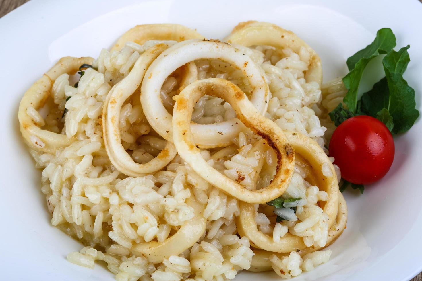 Squid risotto on the plate 12514484 Stock Photo at Vecteezy