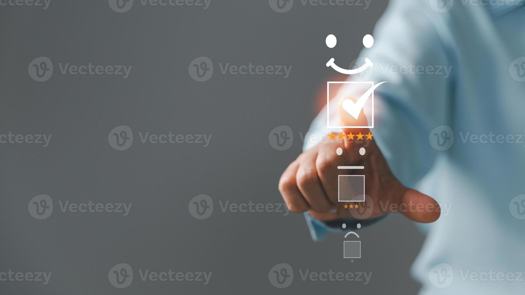 Customer service and Satisfaction concept, Five star consumer feedback. Business people are touching virtual screen on happy Smiley face icon to give satisfaction in service. rating very impressed. photo
