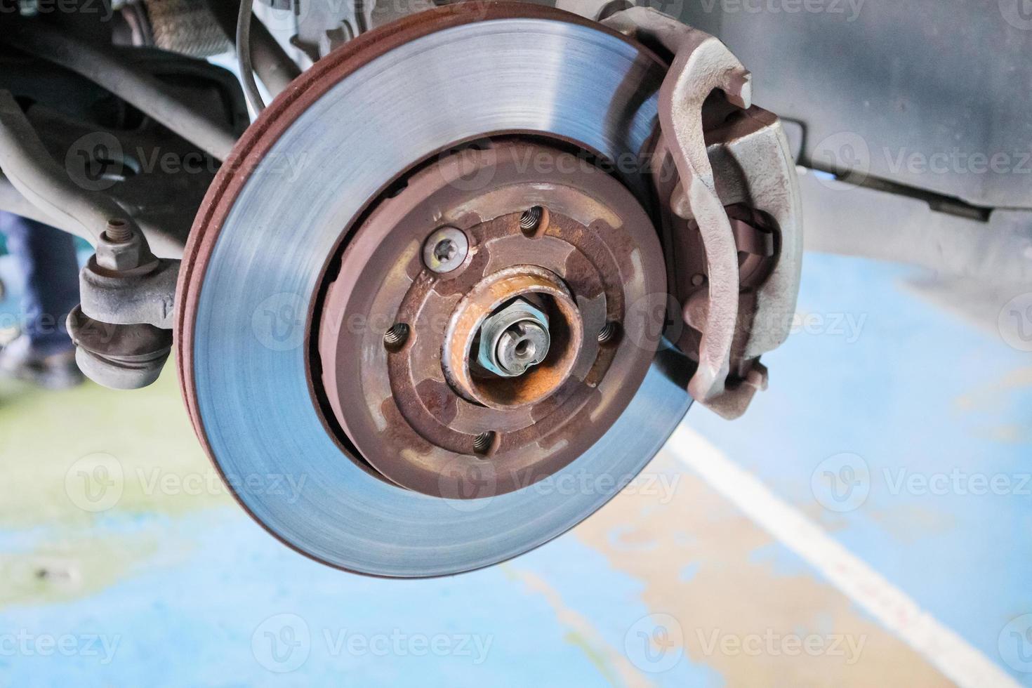 Close up disc brake at car service workshop photo