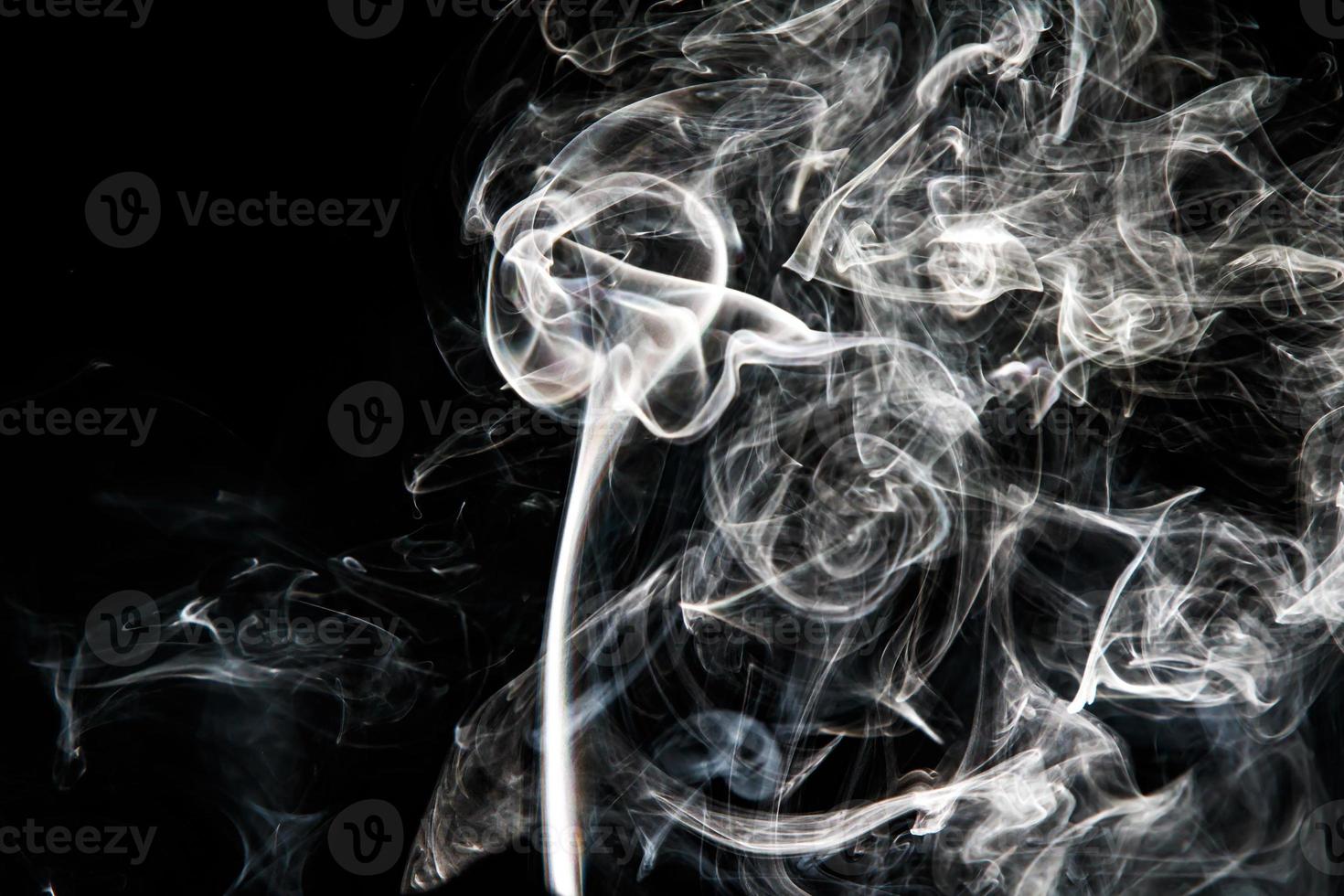 Smoke effect texture. Isolated background. Black and dark backdrop. Smokey fire and mistic effect. photo