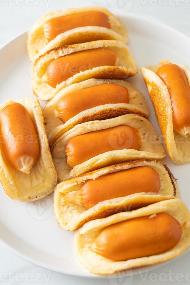 flat pancake roll with sausage photo