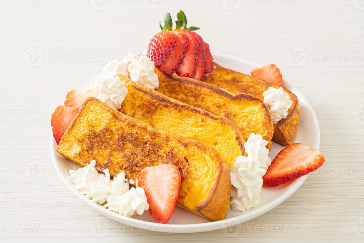 french toast with fresh strawberry and whipping cream photo