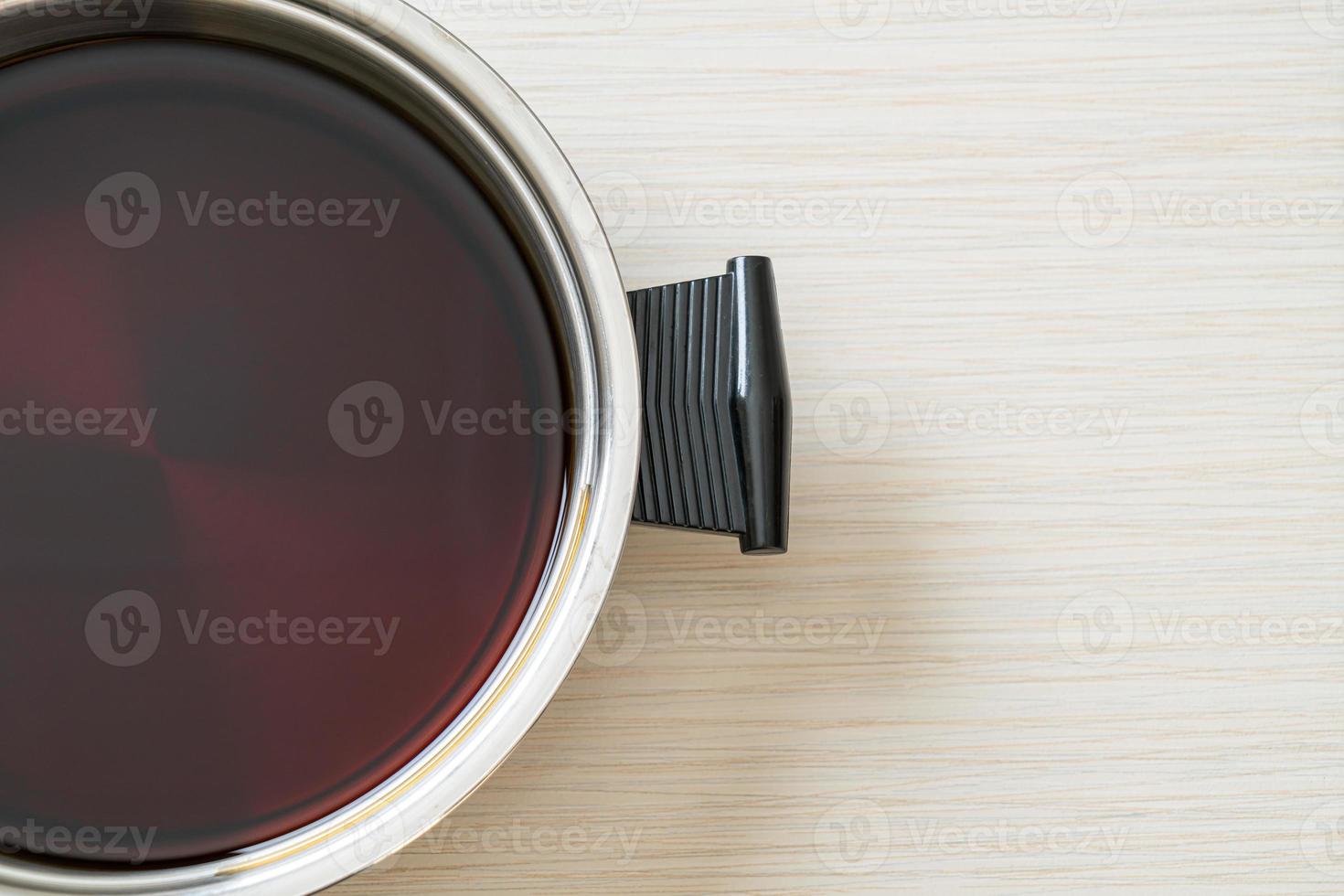 black soup in hot pot for shabu or sukiyaki photo