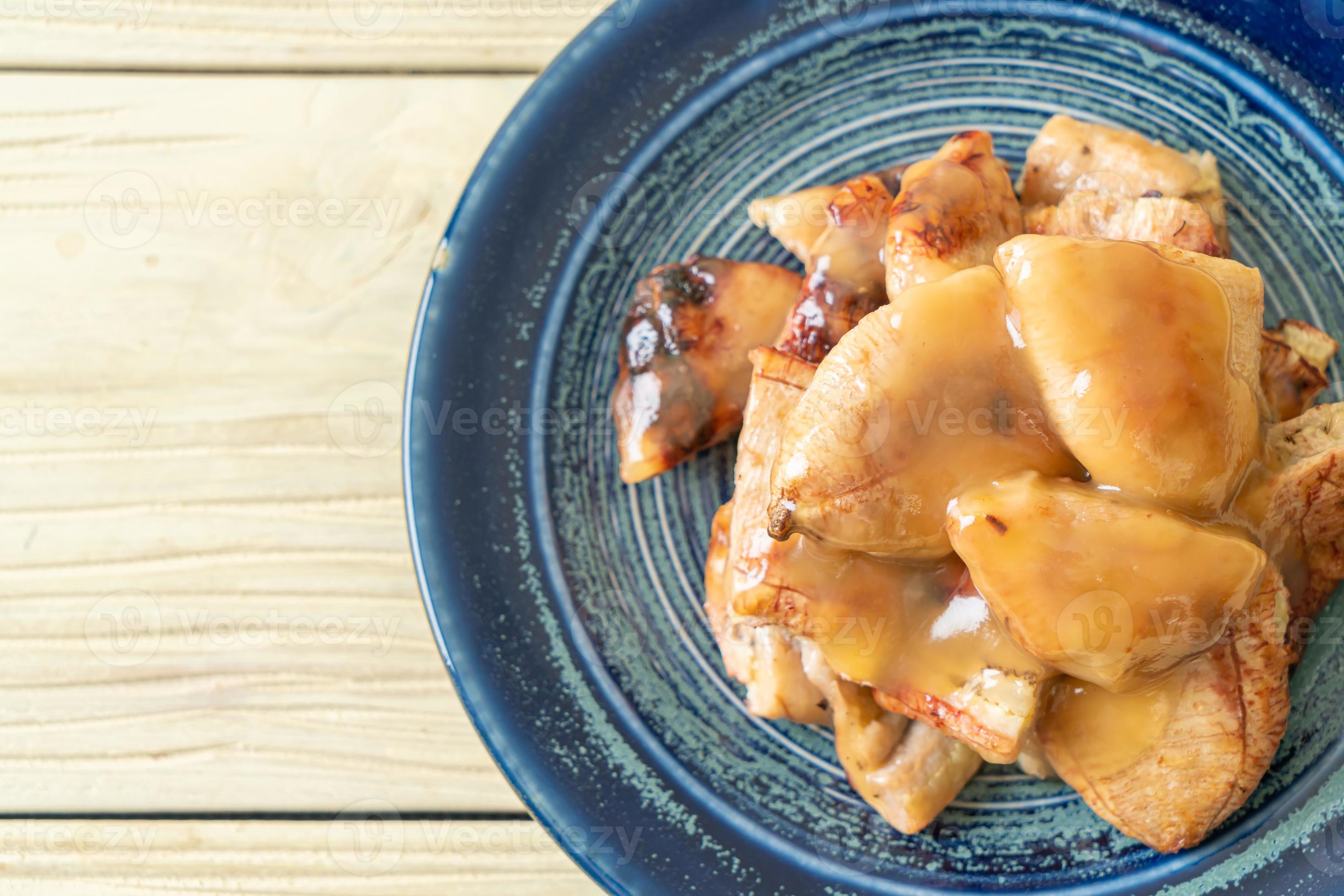 grilled bananas with coconut caramel sauce 12516236 Stock Photo at Vecteezy