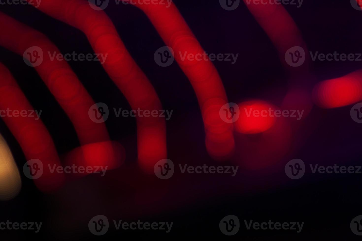 Red Defocus Abstract bokeh light effects on the night black background texture photo