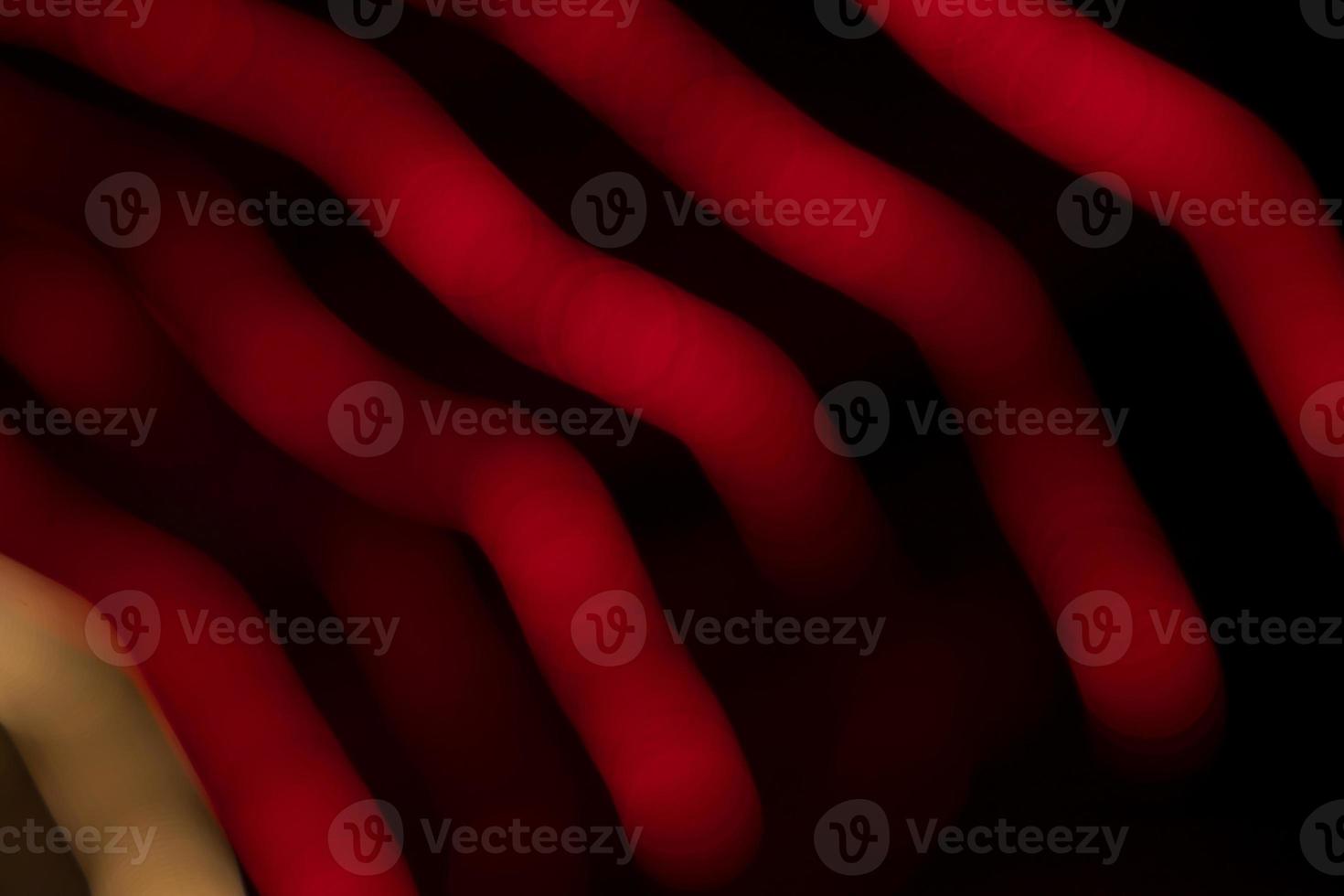 Red Defocus Abstract bokeh light effects on the night black background texture photo