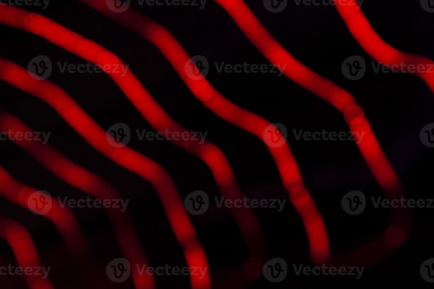 Red Defocus Abstract bokeh light effects on the night black background texture photo