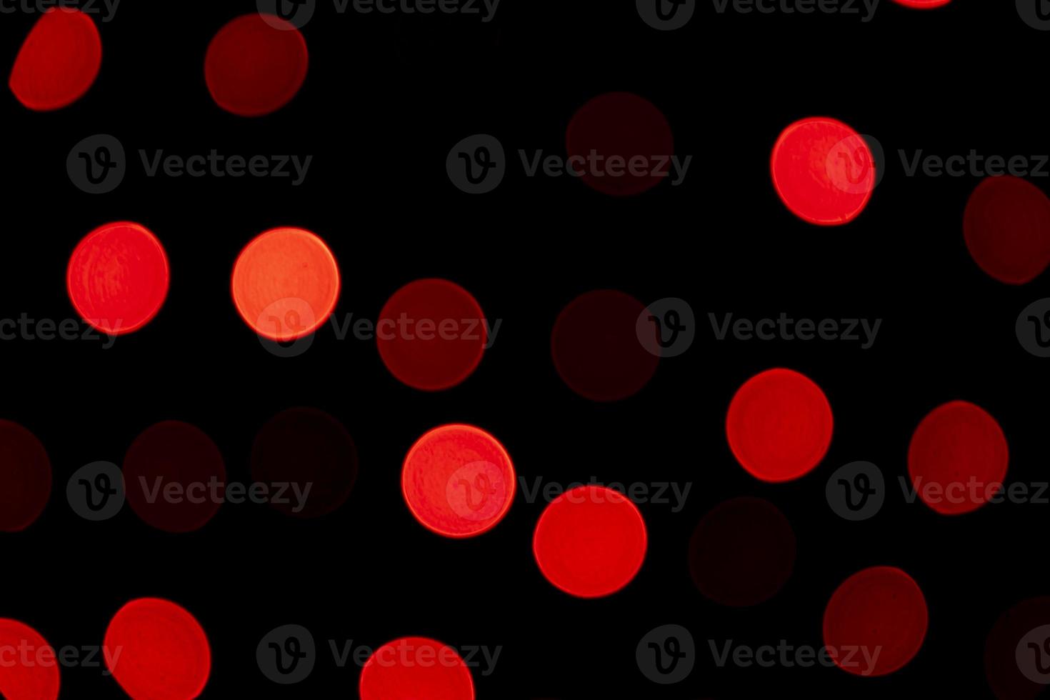 Red Defocus Abstract bokeh light effects on the night black background texture photo