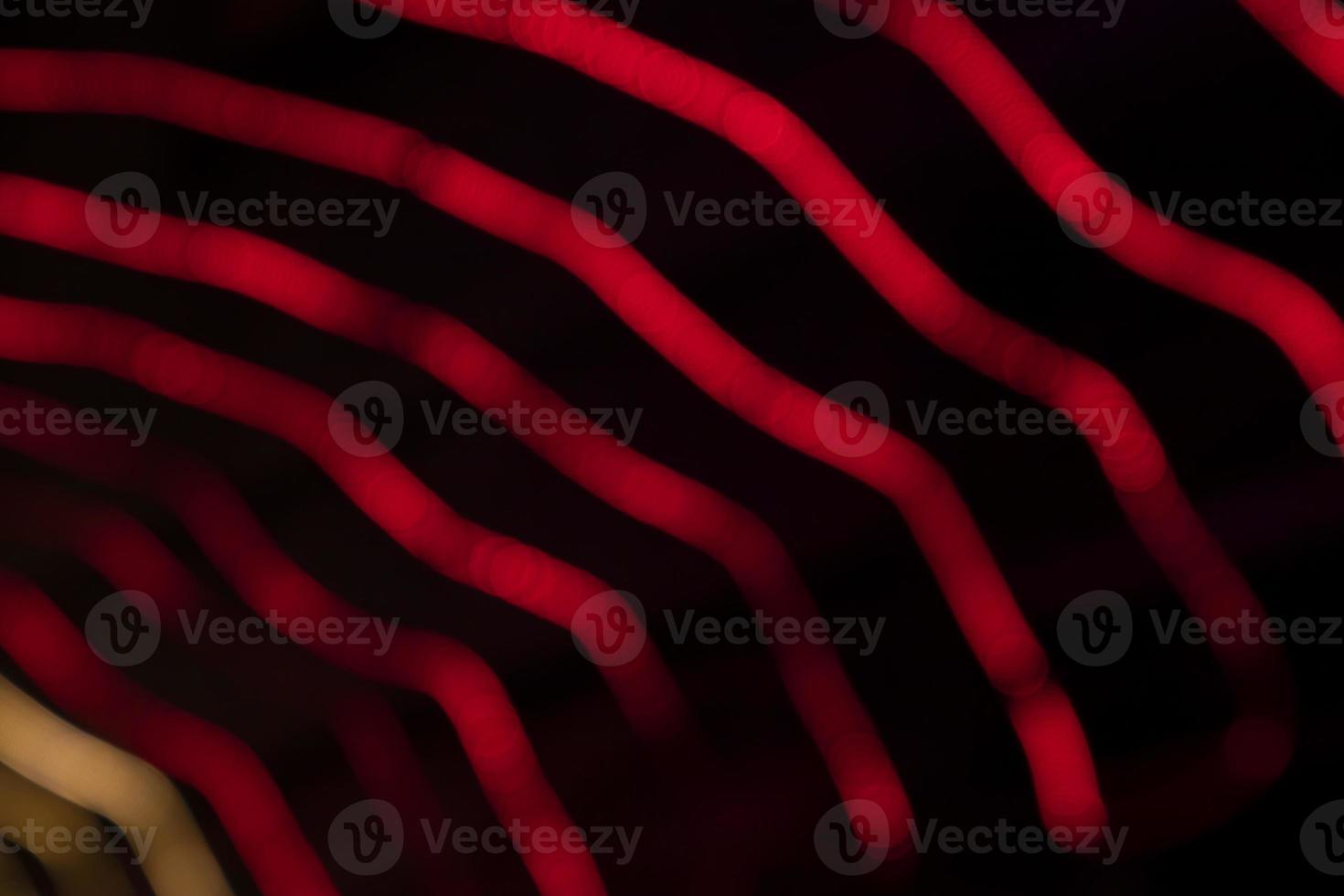 Red Defocus Abstract bokeh light effects on the night black background texture photo