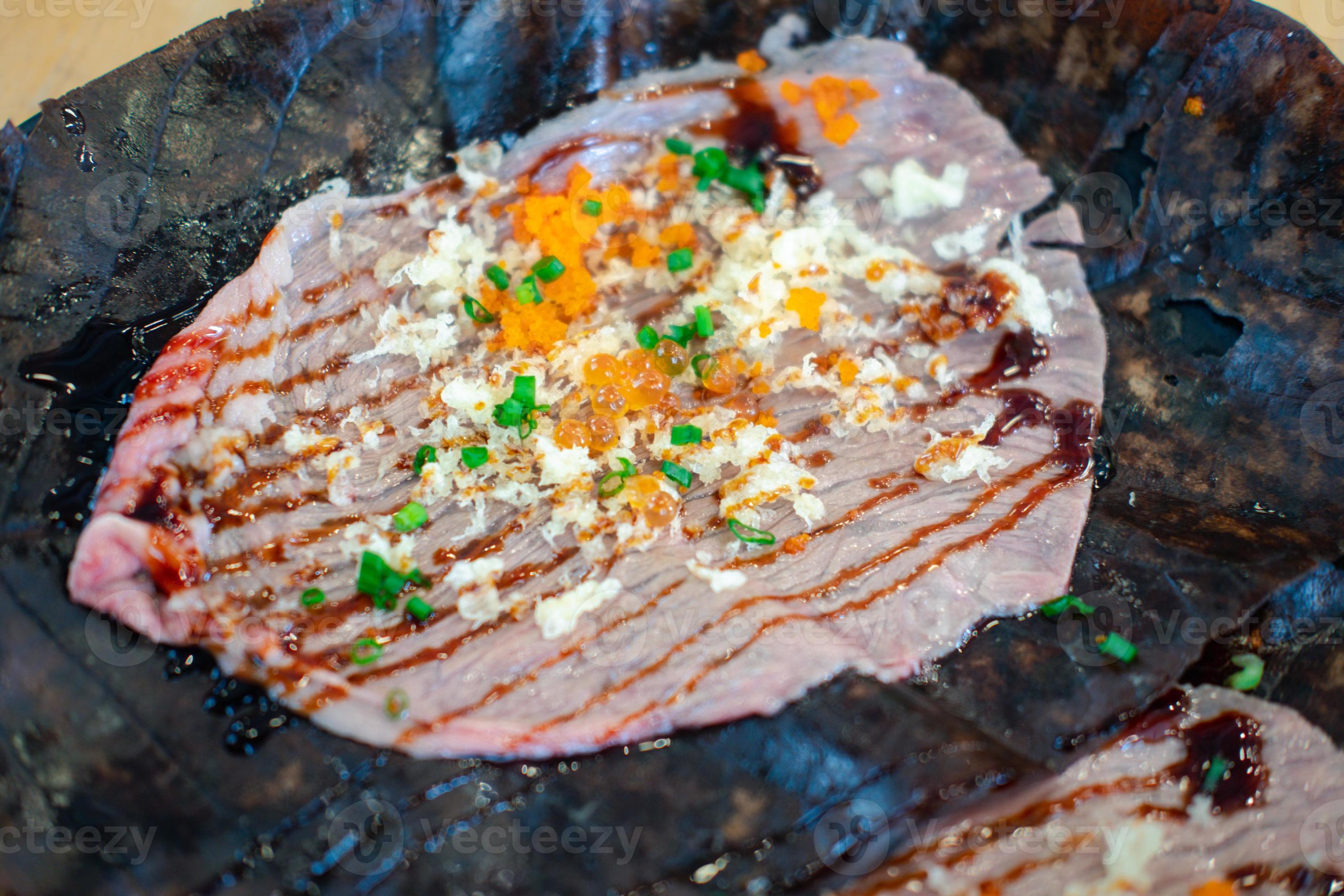 Close up of Wagyu Hoba Yaki beef grilled on dried leaf. 12518981 Stock