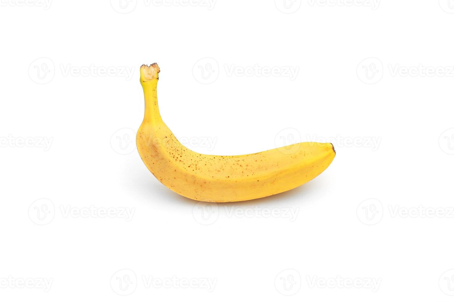 Single yellow ripe banana isolated on white background. Fiber fruits photo
