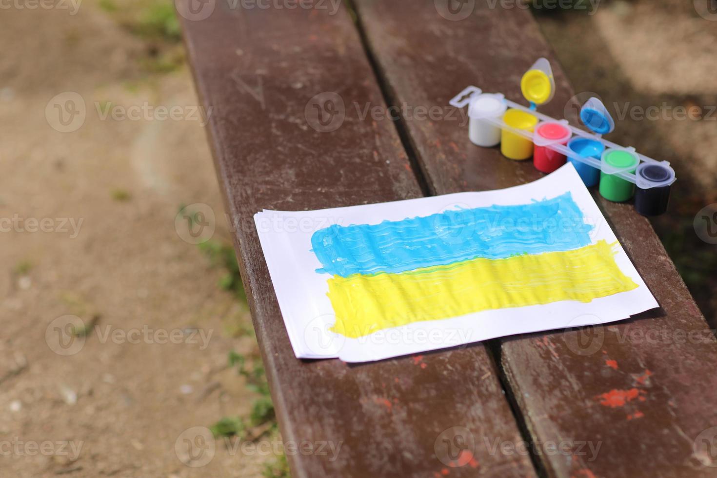 Children's drawings against the war in Ukraine. A call for peace, a drawing of the Ukrainian flag and a heart in yellow and blue color. High quality photo