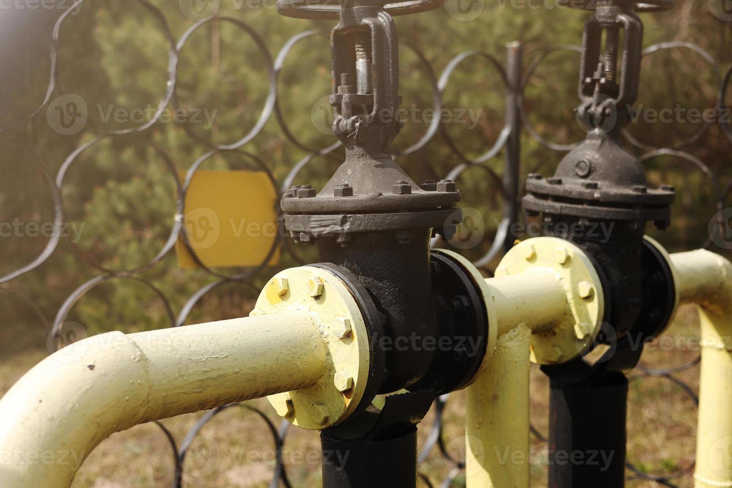 Yellow gas pipes and valves outdoors. gas equipment. Copy space for text. High quality photo