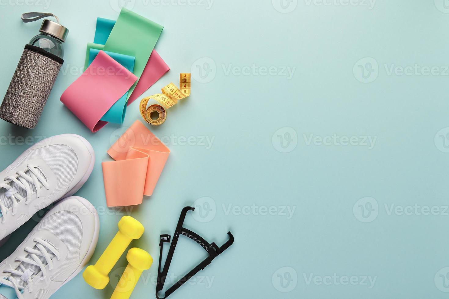 Creative flat lay of sport and fitness equipments. photo