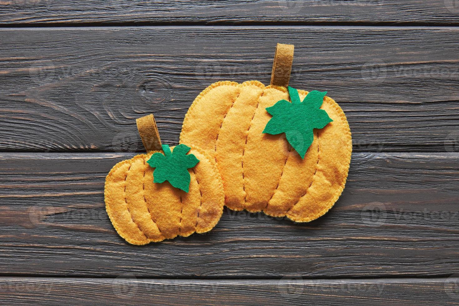 Step-by-step instructions for decorative crafts pumpkin made of felt for Halloween. photo