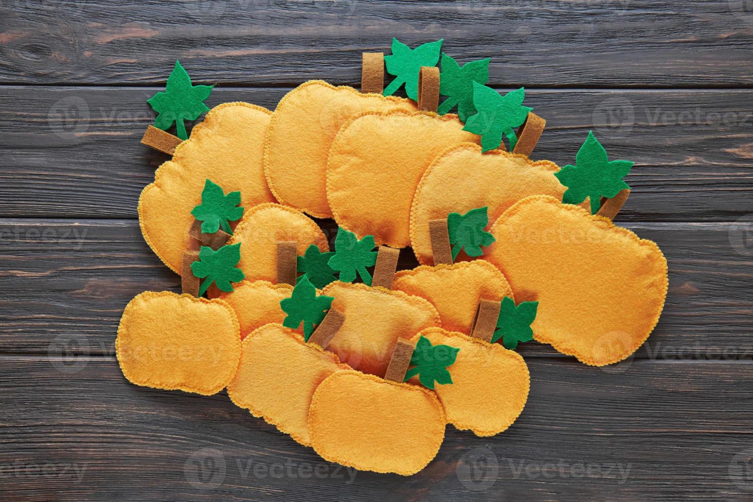 Step-by-step instructions for decorative crafts pumpkin made of felt for Halloween. photo