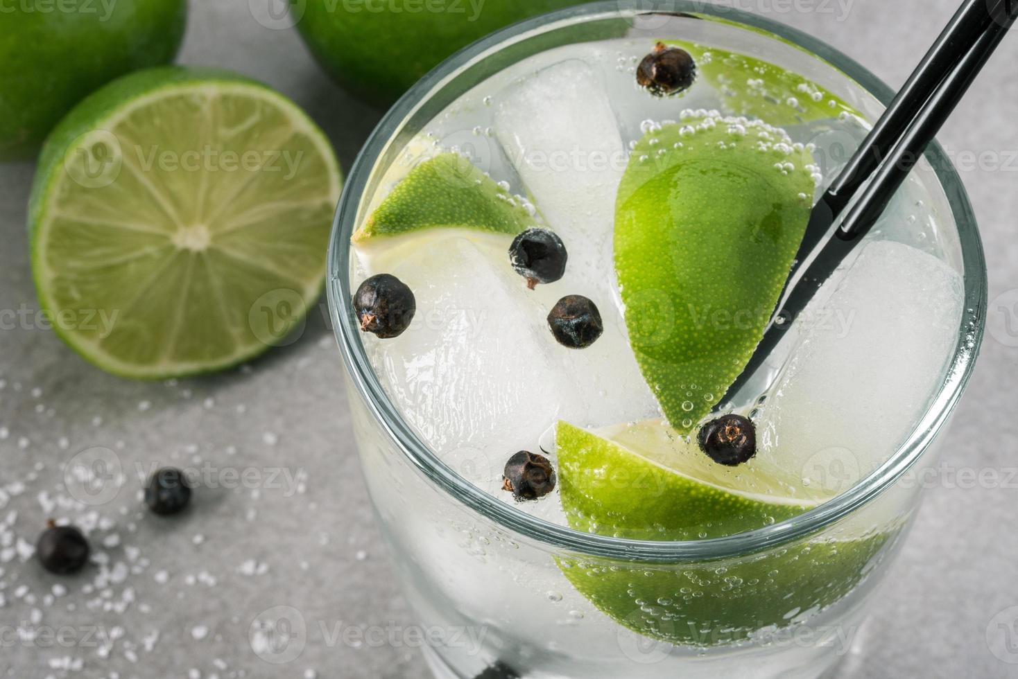 Gin and Tonic with Lime and Juniper Berries photo