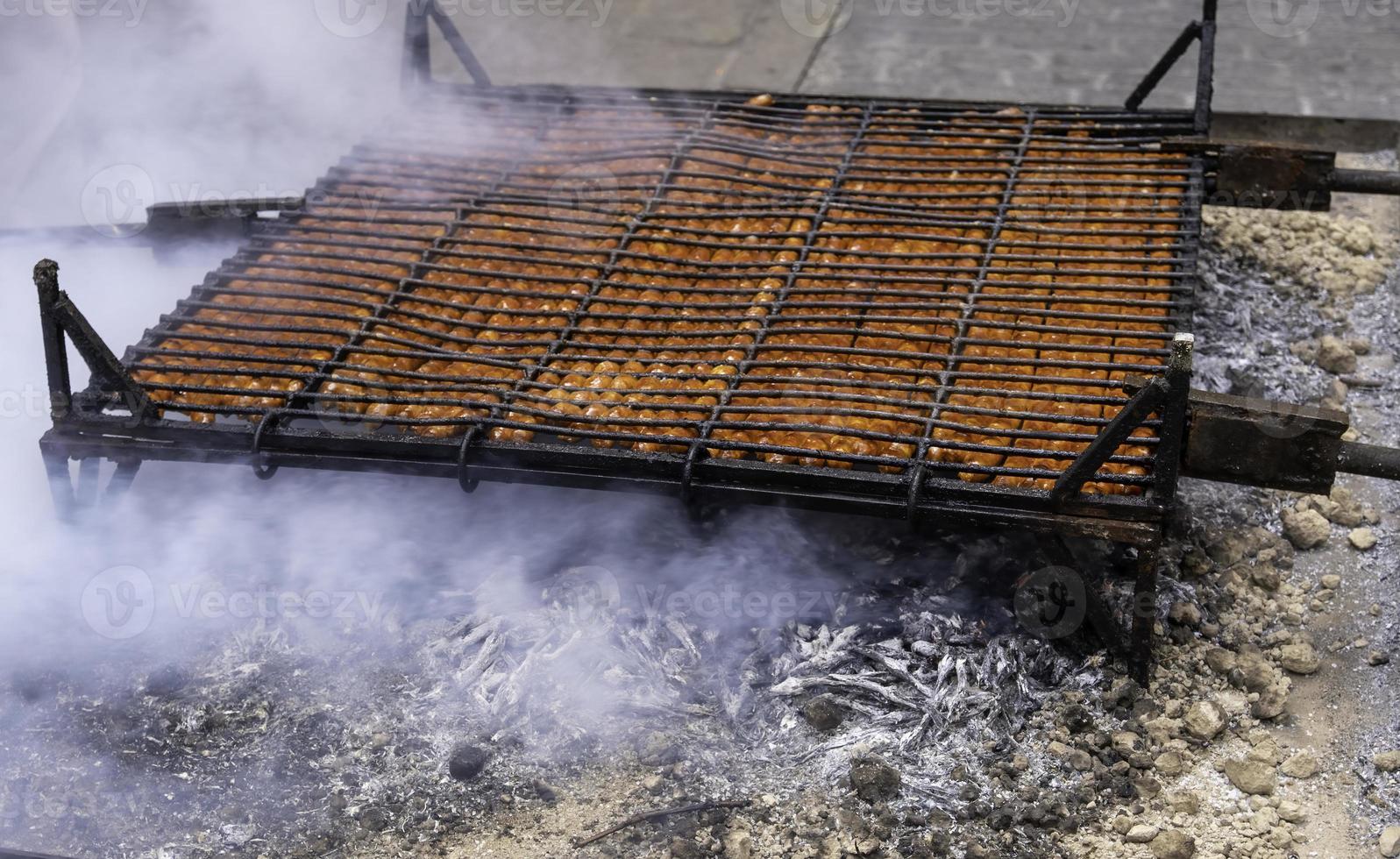 Grilling sausage with fire photo