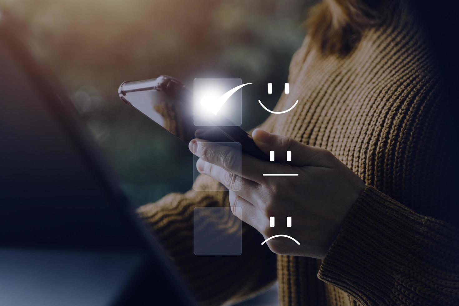 Satisfaction and Customer service concept ,Business people are touching the virtual screen on the happy Smiley face icon to give satisfaction in service. rating very impressed. photo