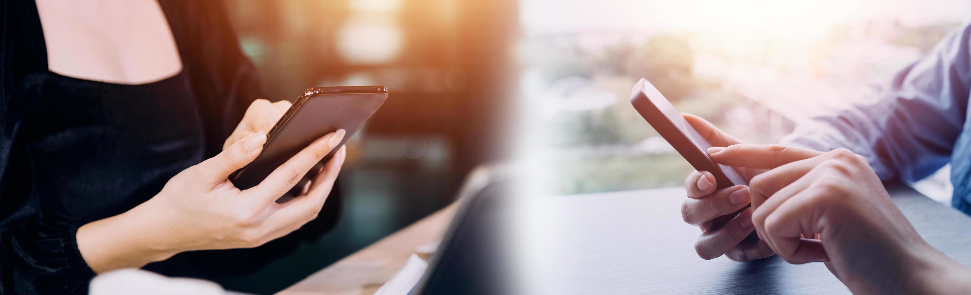 Businessman hands working with finances about cost and calculator and laptop with tablet, smartphone at office in morning light photo
