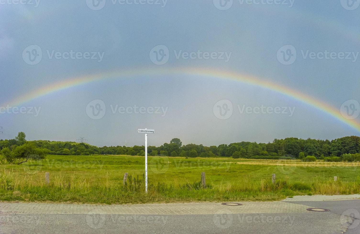 Beautiful rainbow and clouds on the horizon in Bremerhaven Germany. photo