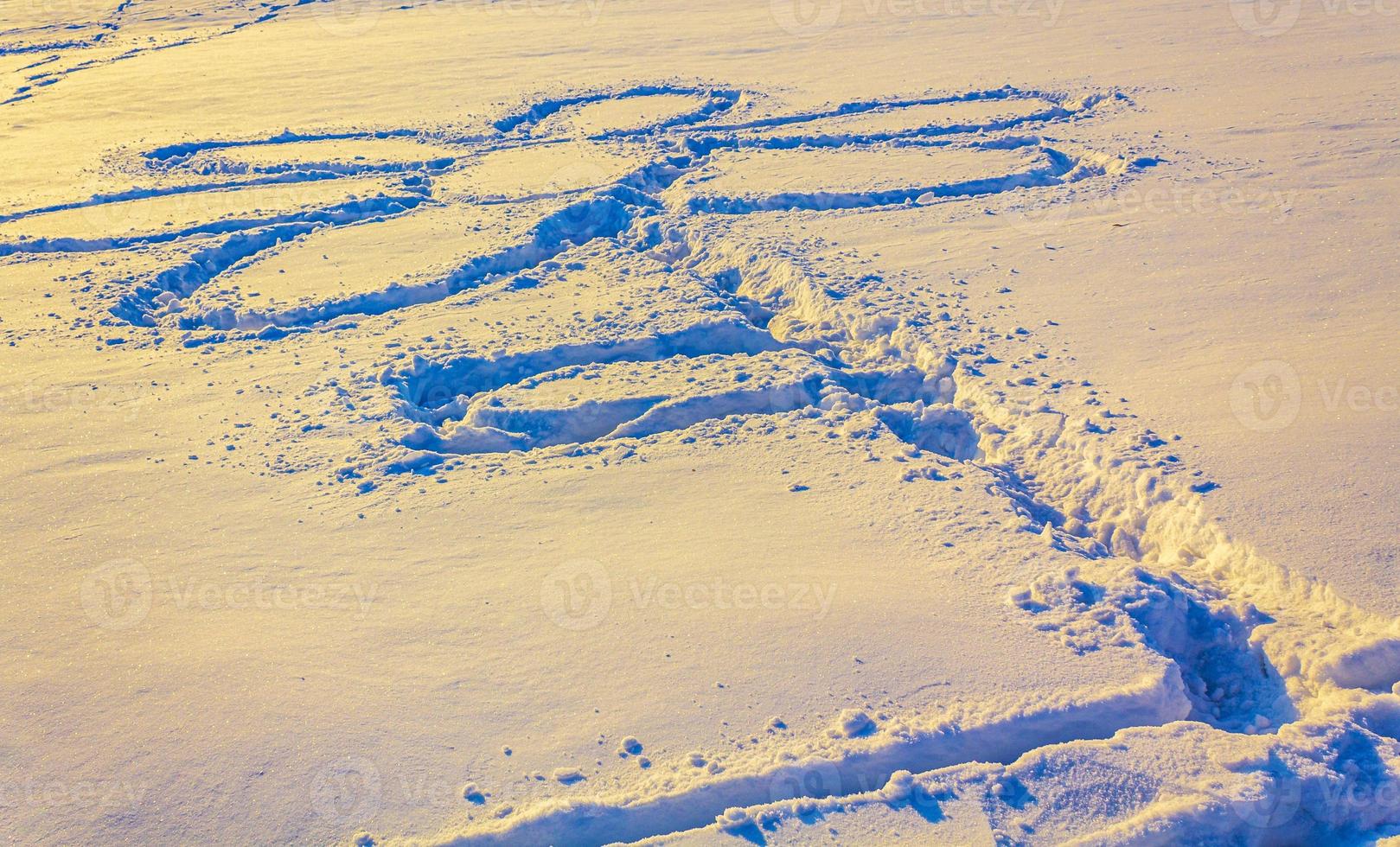 Flower drawn in the snow Bremerhaven Germany. photo