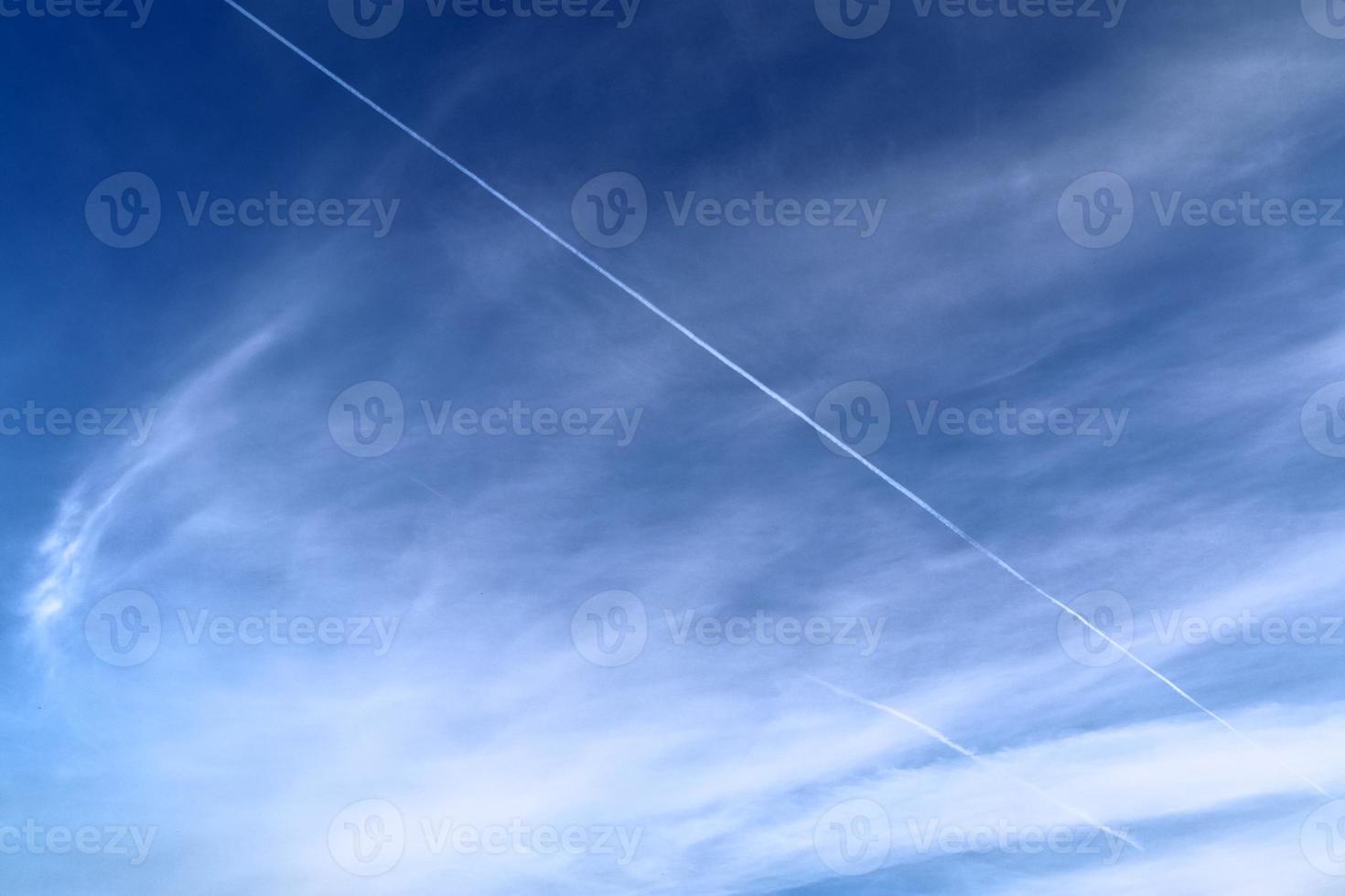 Stunning cirrus cloud formation panorama in a deep blue sky photo