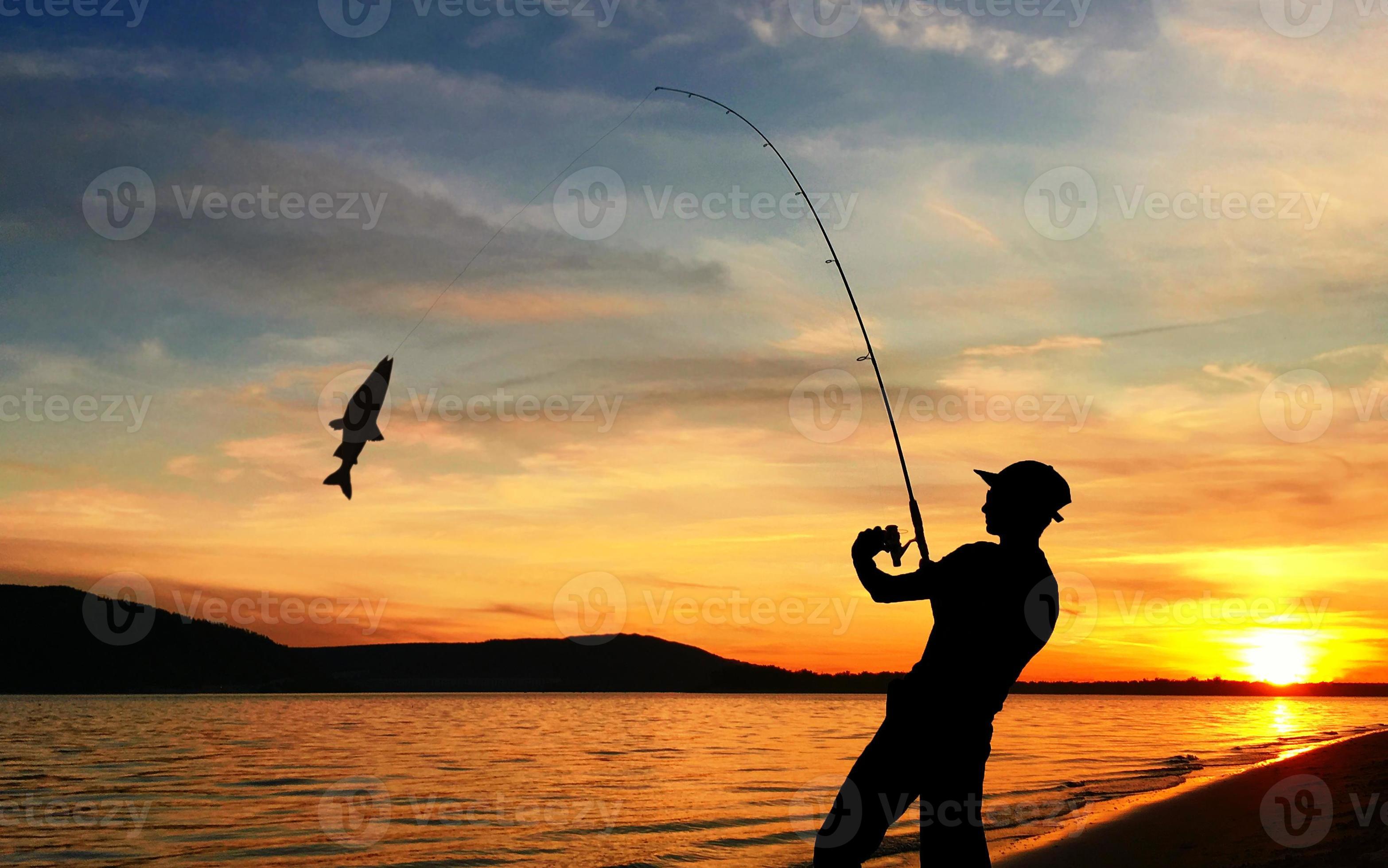 Young Man Fishing at Sunset 12528119 Stock Photo at Vecteezy