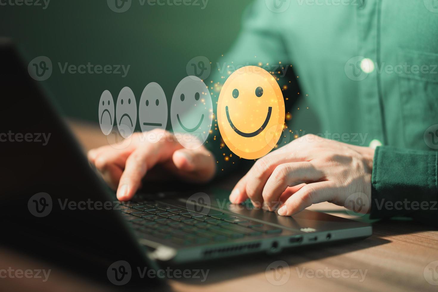 Man using a laptop in give rating to service experience on application. Online customer review satisfaction feedback survey. photo