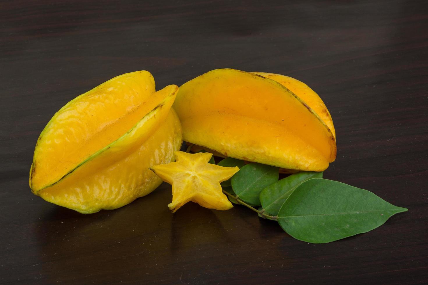 Carambola on wooden background photo