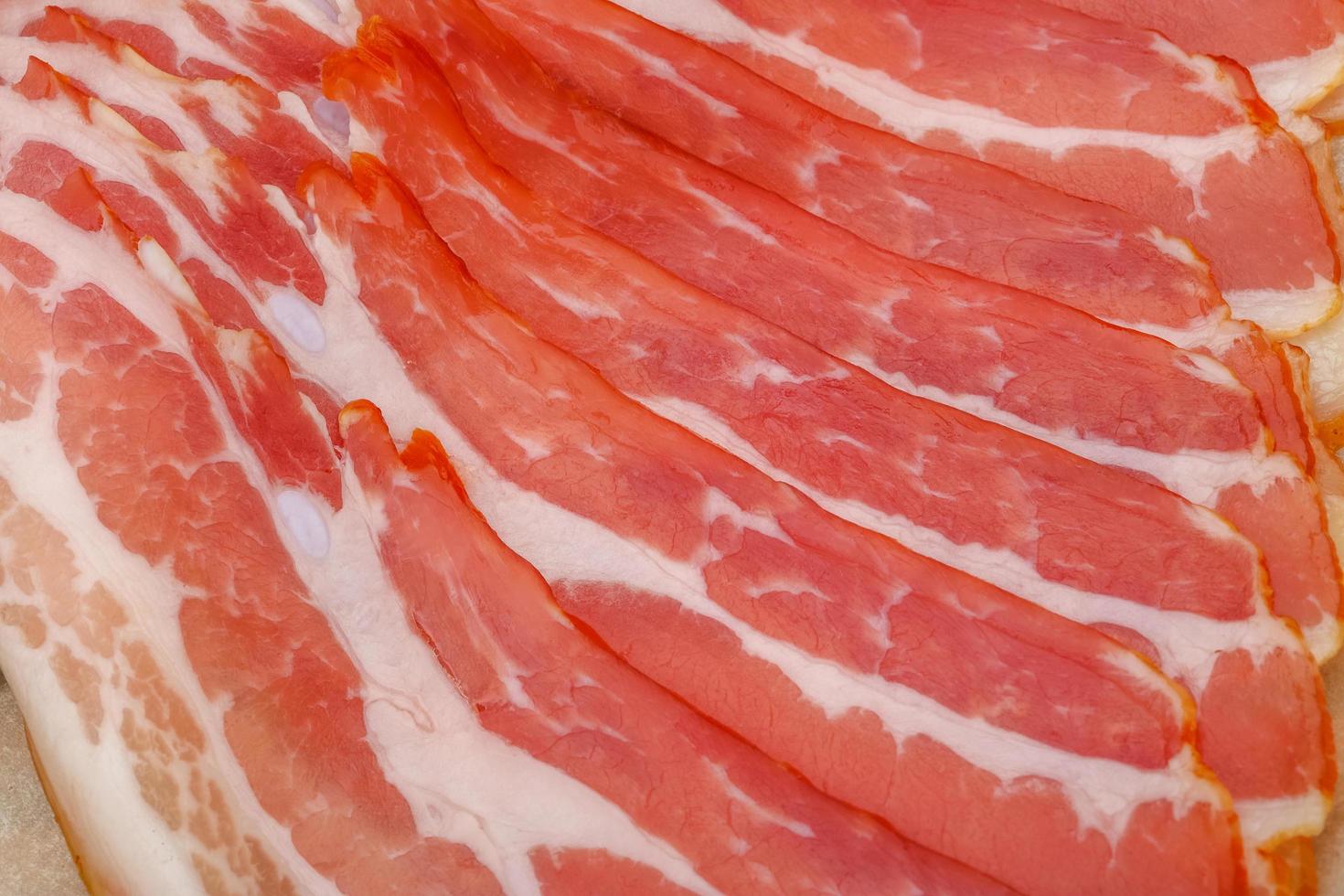 Sliced bacon close up view photo